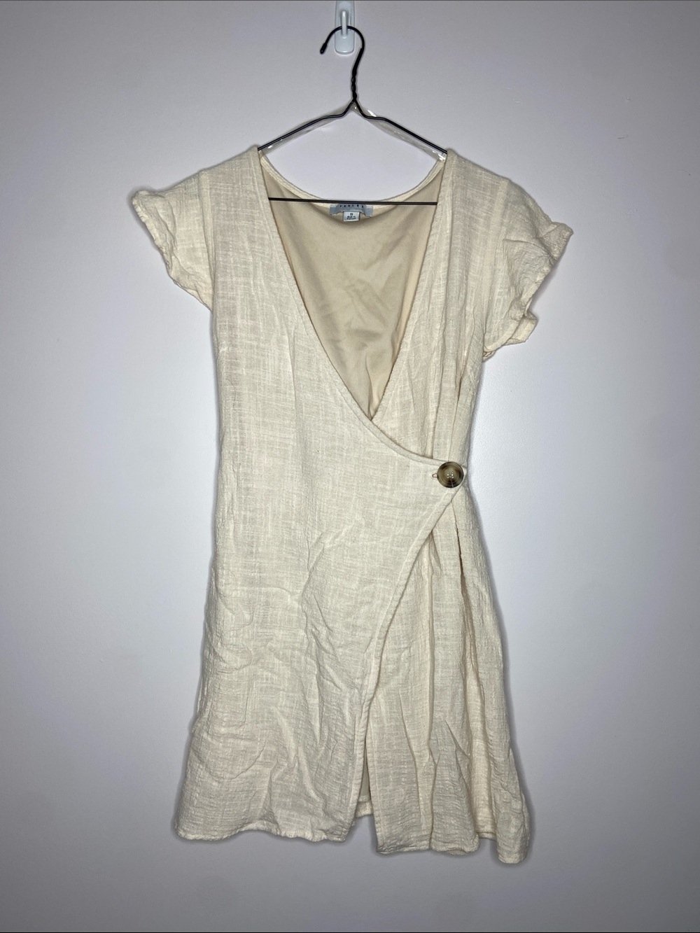 FAVLUX Cream Wrap Mini Dress with Button Accent
